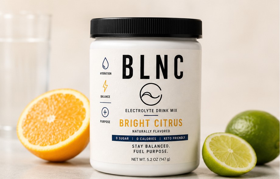 BLNC Bright Citrus electrolyte jar with fresh orange and lime.